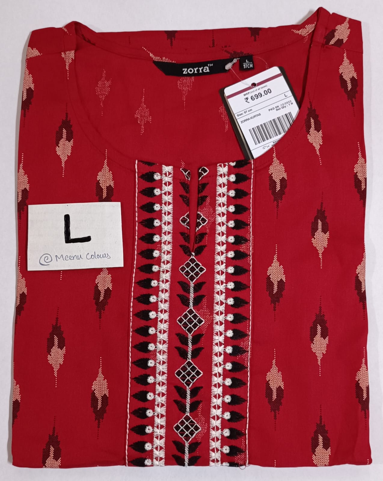 Red rayon kurti with white and black abstract prints, embroidered front panel, round neckline, and sidecut – Zorra brand, size L.